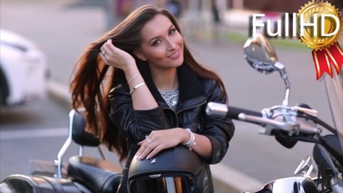 Attractive Woman Posing on Motorcycle in Urban Setting