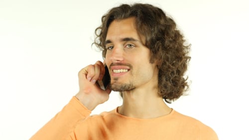 Young Man Talking on Cell Phone Smiling