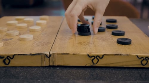 Von Checkers On Checkerboard On The Table