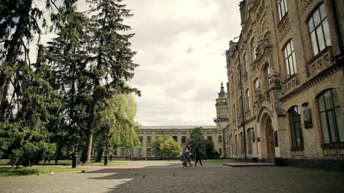 Students Come Into The University Building