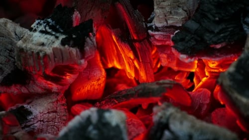 Glowing Embers and Charred Charcoal Abstract Close-Up