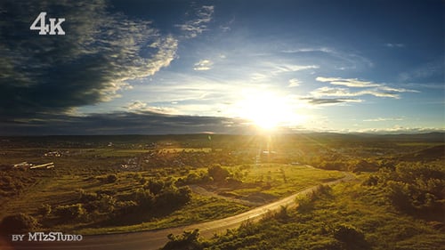 Aerial View of Sunrise Over Rural Landscape