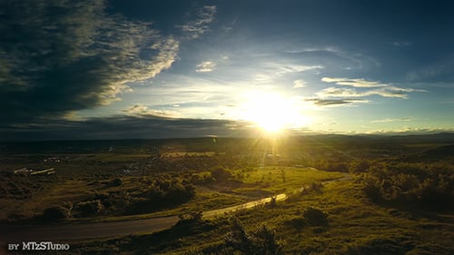 Aerial View of Rolling Hills During Sunrise