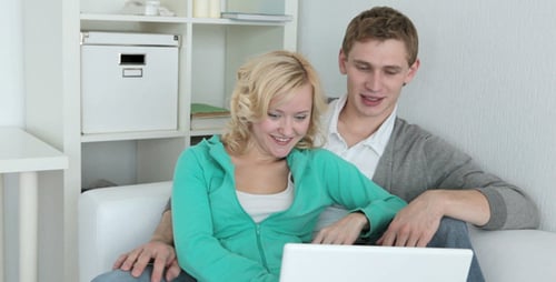Young Couple Using Laptop Together at Home