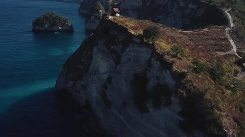 Aerial View of Small Wooden House on the Cliff