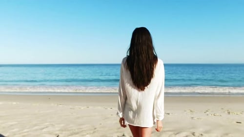 Woman walking on beach
