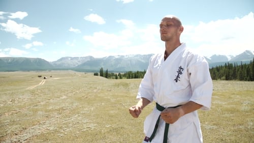 Man Training Karate Outdoors in Nature