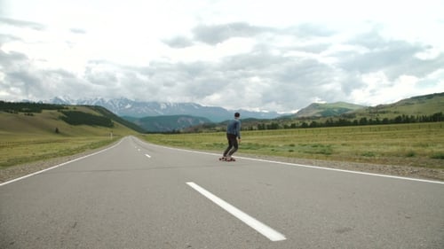 Hipster Man Longboarding Extremely Action In Highway.