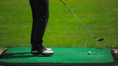 A Club Hits The Ball Near The Course