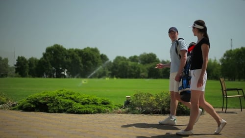 Golfers Walking on Course on a Sunny Day