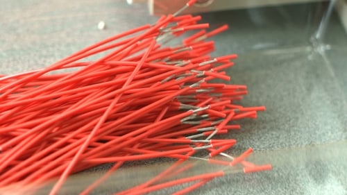 Close Up of Red Wires Ready for Production