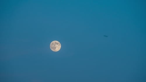 Full Moon Glowing in a Blue Sky