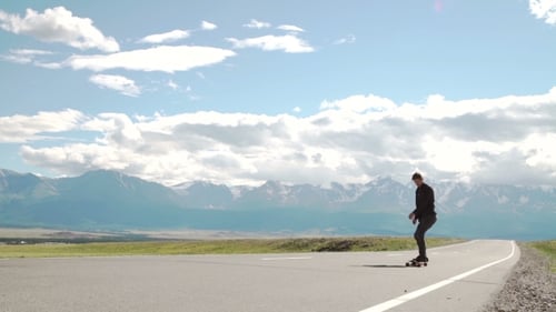 Hipster Man Longboarding Extremely Action In Highway Tropics In Asia