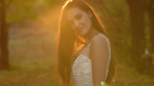Young Woman Posing in White Dress in Golden Hour
