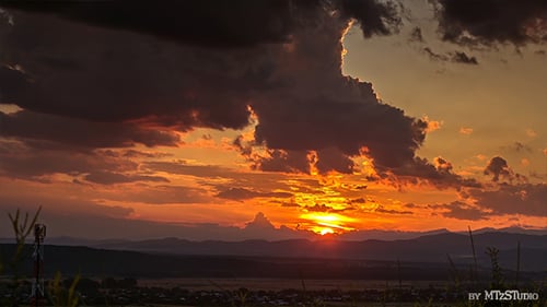 Stunning Sunset Time-Lapse over Hilly Landscape