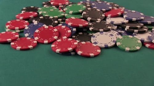 Colorful Casino Chips on Green Background