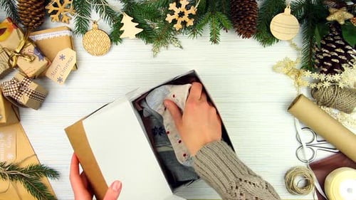 Packing Holiday Socks in Gift Box for Christmas
