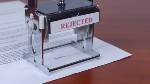 Rejected Stamp on Contract Document on Desk