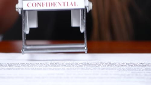 Rubber Confidential Stamp on Legal Document