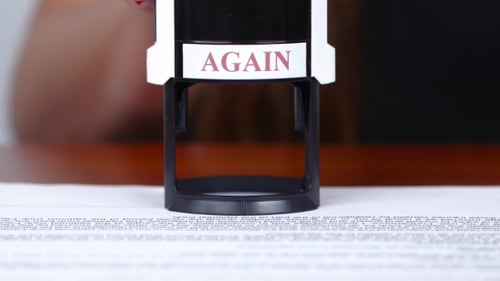 Again Stamp on Document in Office Setting