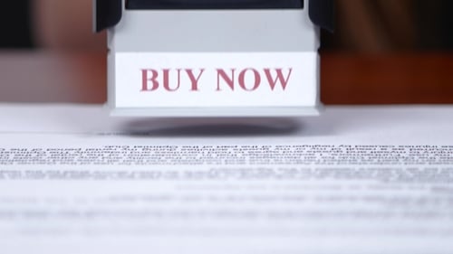 Employee Is Doing Office Work On Documents With a Rectangular Print.