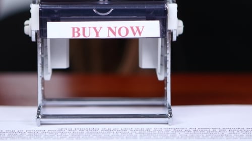 Worker Is Doing Office Work On Documents With a Rectangular Print.