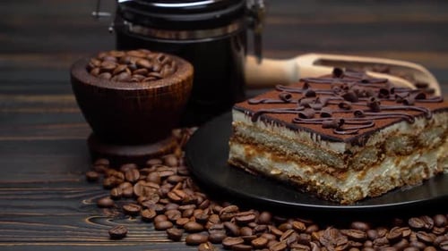 Delicious Tiramisu Dessert on Wooden Table with Coffee Beans