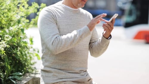 Senior Man Calling On Smartphone In City