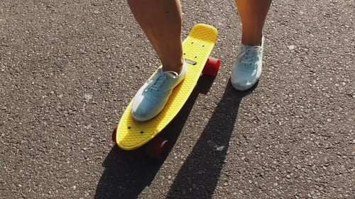 Teenage Girl Feet Riding Short Modern Skateboard