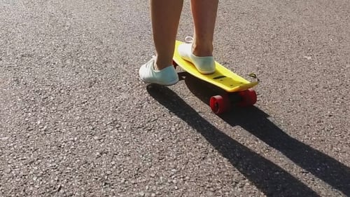 Teenage Girl Feet Riding Short Modern Skateboard