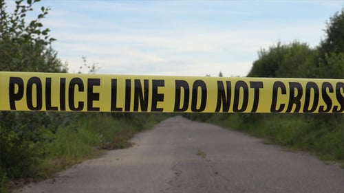 Police Line Blocking Road in Rural Area