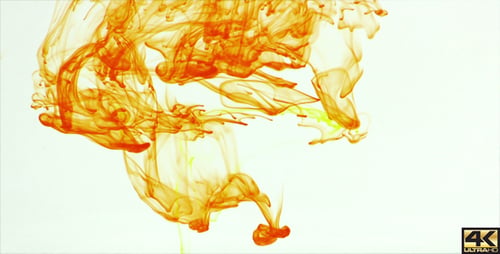 Vibrant Orange Ink Swirling in Clear Liquid
