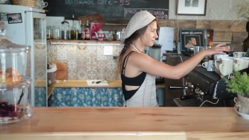 Smiling Barista Making Coffee In a Cafe