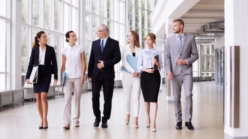 Business People Walking Along Office Building 2