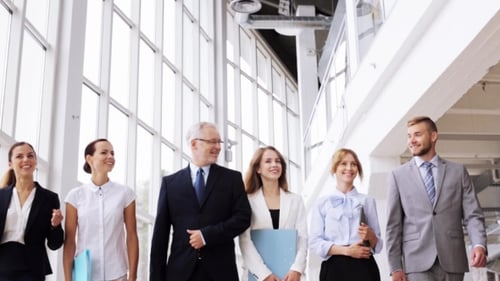 Business People Walking Along Office Building 4