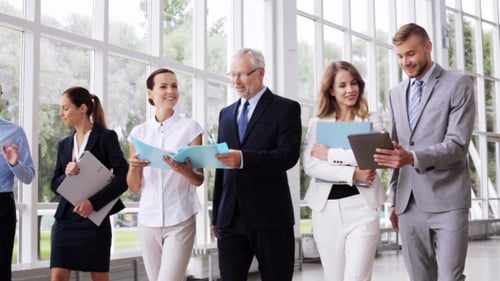 Business People Walking Along Office Building 14