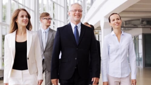 Business People Walking Along Office Building 61