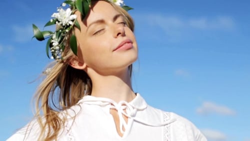 Woman with Floral Crown Looking Toward the Sky
