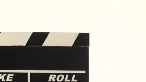 Person Uses Movie Clapper Board, On White,