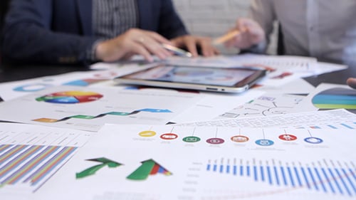 Financial Analysis with Charts and Digital Tablet