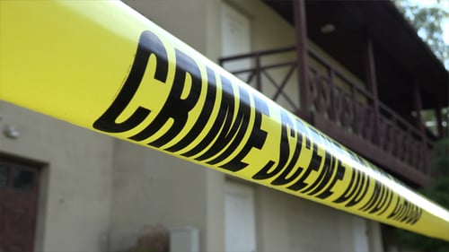 Crime Scene Tape Blocking Suburban House