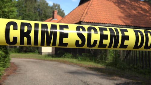 Crime Scene Tape Barricade on a Sunny Day