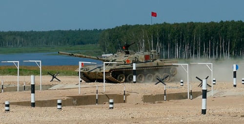 Tank Driving on Military Obstacle Course in Daytime