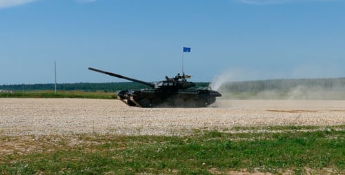 Tank Driving on Gravel Road on Sunny Day