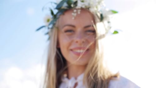 Woman Smiling Wearing Flower Crown in Nature