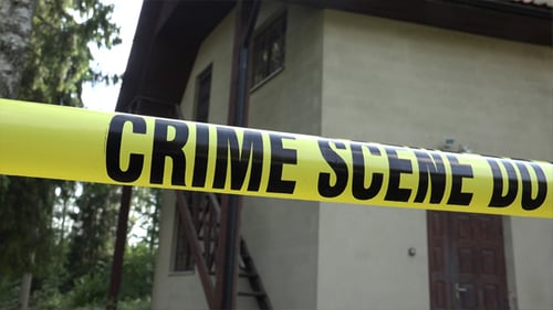 Crime Scene Tape Blocking Suburban Home