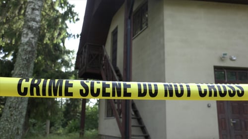 Crime Scene Tape Surrounds Suburban Home