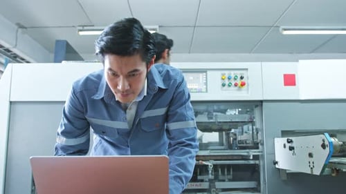 specialist worker engineer team control and operate printing package lable machine