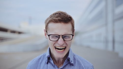 Young Adult with Exaggerated Facial Expressions Close Up