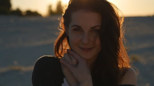 Pretty Woman Posing At Sea Background In At Sunset